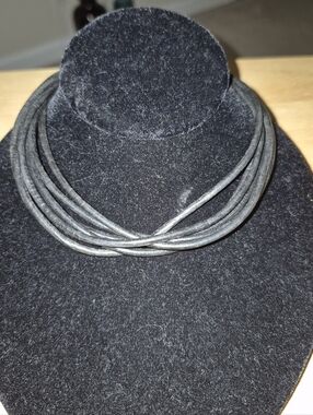Multi-strand leather cord necklace with a magnetic clasp.